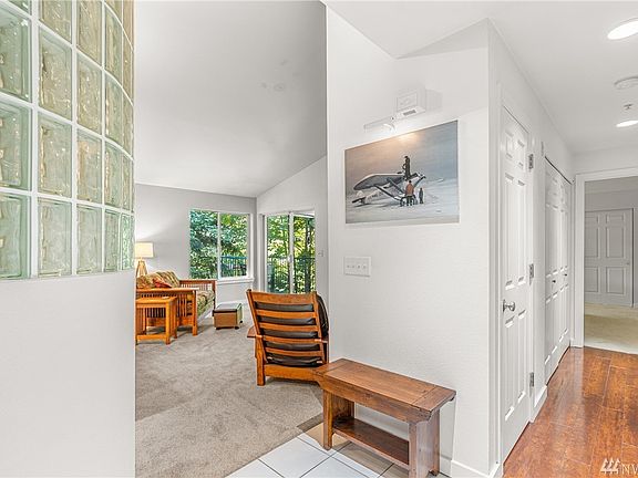 Kitchen and living area is on your left, the hall to beds and baths on your right.