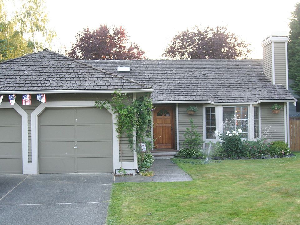 Two car garage and Bay windows.