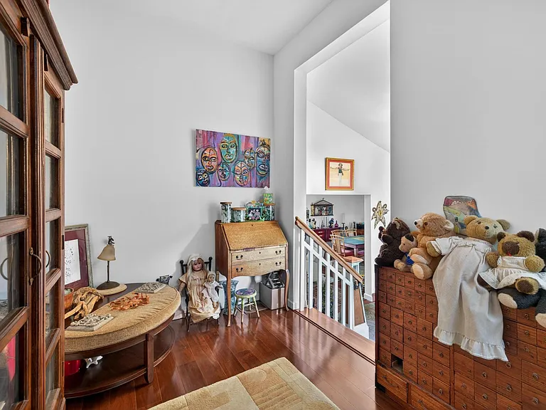 Hallway on the 2nd floor to 2 bedrooms and 3rd floor bedroom and 4th floor loft. My wife will probably want her mothers collection of stuffed animals on top of the apothecary chest.