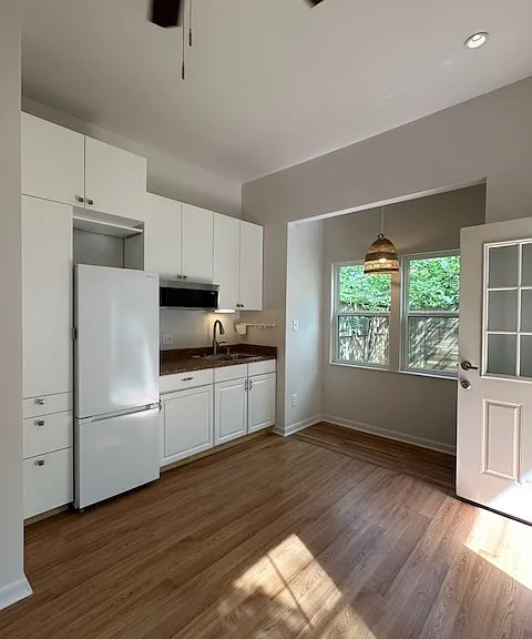 Cooking will be handled by an induction cooktop, and by microwave if desired. Storage has been maximized in this small space.