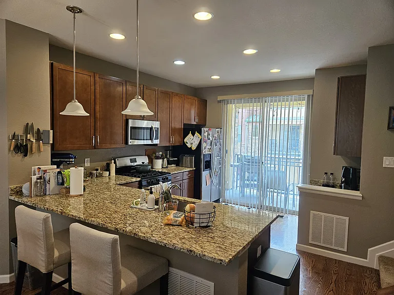 Looking into kitchen and sliding doors to covered patio