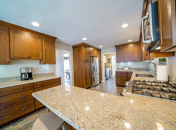 Remodeled with new cabinetry, granite countertops, stainless steel appliances (all included), breakf