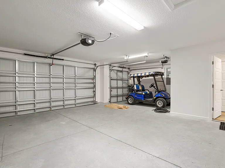 3 car garage with gas golf cart