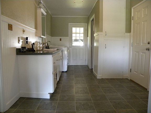 Large laundry/mud room with 3/4 bath..