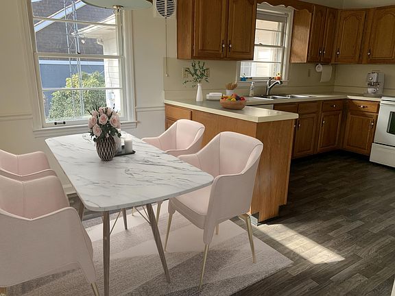 Bright breakfast area overlooking backyard.