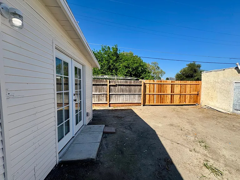 Large parking spot with a lockable full-height gate for privacy and security.