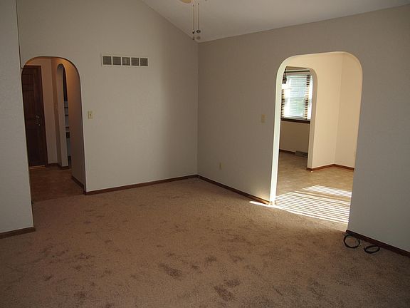 View from living room to entry way and dining room.