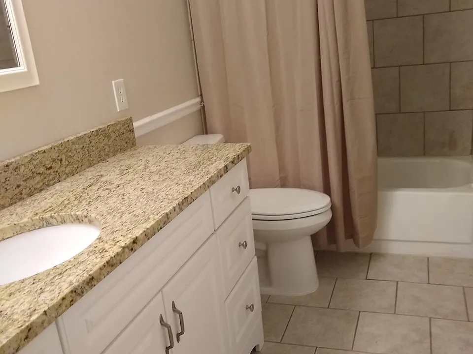 Bathroom with tub and shower.