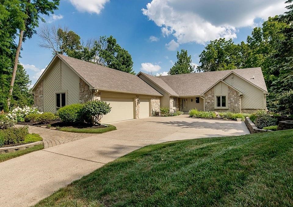 Custom built ranch with 3 car attached garage on a beautiful