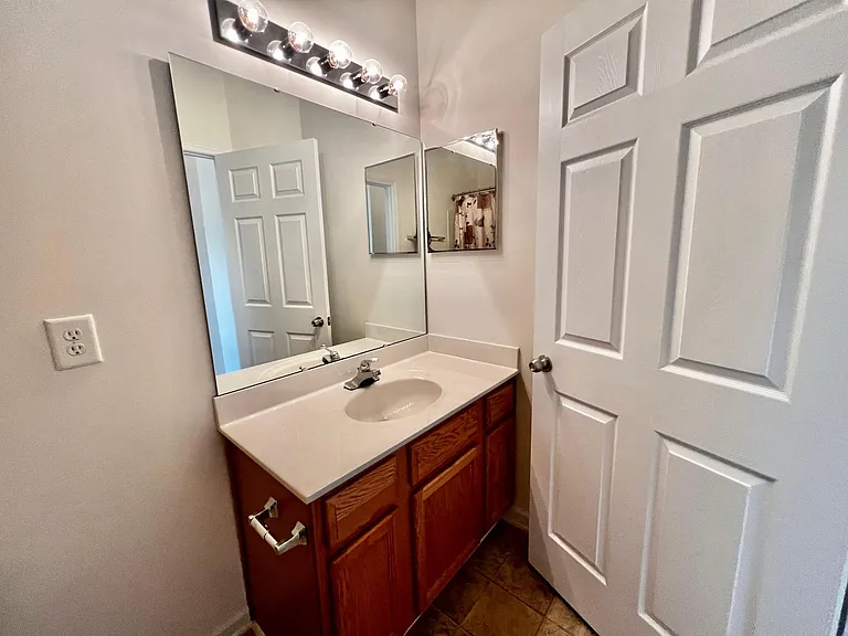Plenty of cabinet space plus a large hall closet just off the bathroom