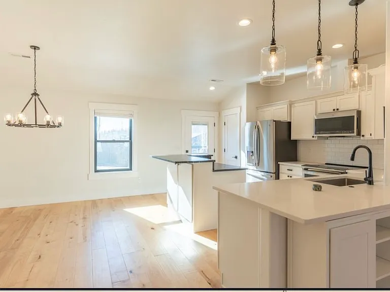 Kitchen and open dining room
Door to backyard