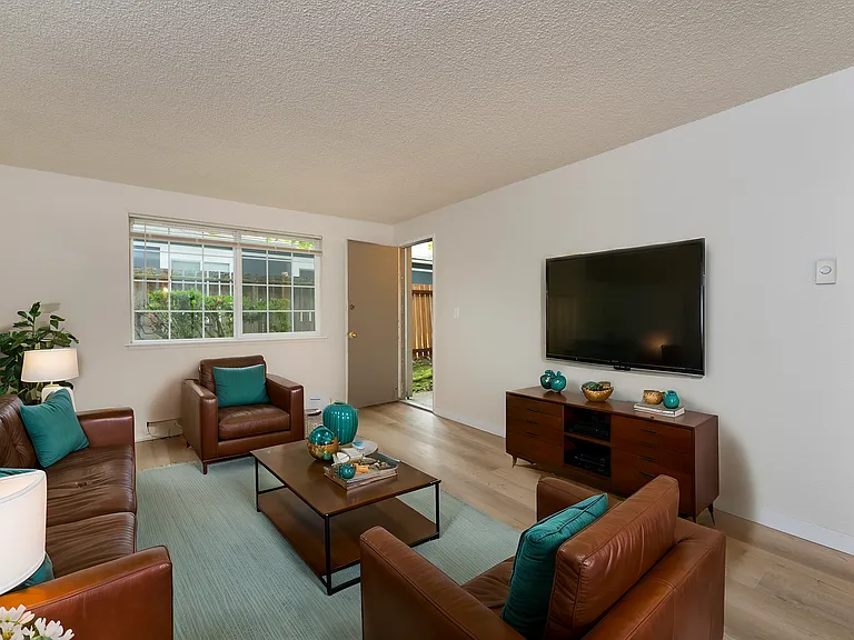 Relax in this beautifully designed living room featuring chic furnishings and modern decor. Relax in this beautifully designed living room featuring chic furnishings and modern decor.