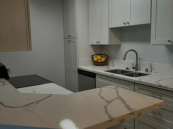 Breakfast counter in Kitchen/Dining Room, New quartz countertops..