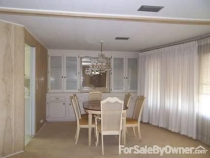 Dining Room : Built in china cabinet in rear of photo. Table and chairs go with property