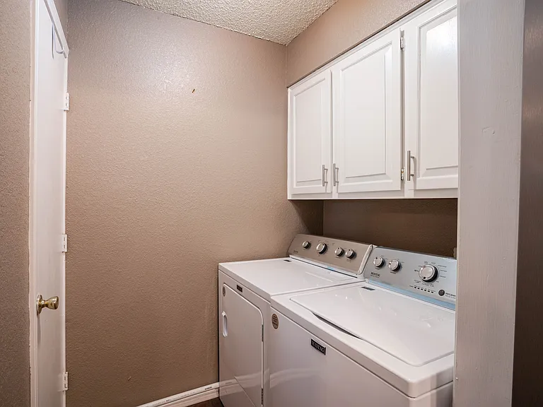 Full size washer and dryer. Laundry detergent provided.