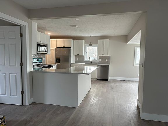 Open concept kitchen with room for a few barstools at the counter!