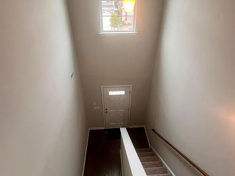 Grand stair case and entrance to house