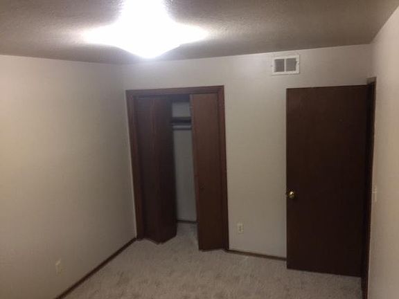 Second carpeted bedroom