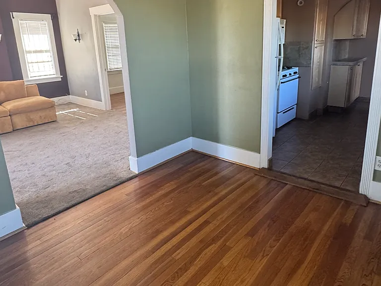 dining room with kitchen and living room