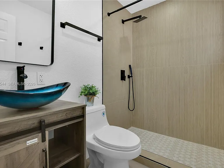 7501 Raleigh St — Photo 11
