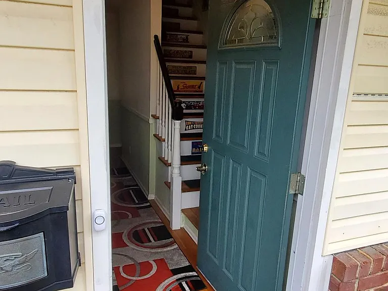 Front door. entrance to Apartment up stairs to the right