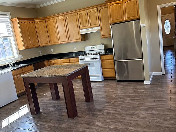 Open concept kitchen with living area.
Large moveable island. Can be used as a dining table too.