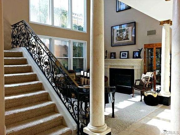 Living Room with Black Galaxy Granite Fireplace with a Faux Marb