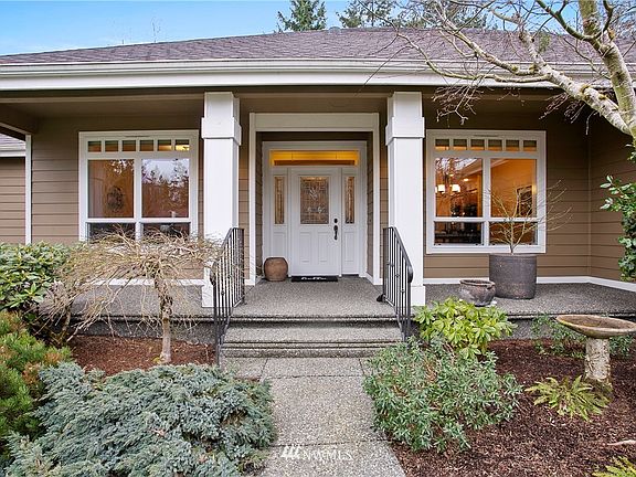 Come on in - covered front patio wired for your holiday lights.
