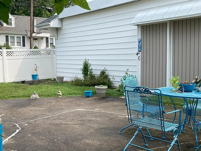 back patio with garage side door
patio furniture included