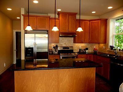 Kitchen has granite countertops, marble backsplash and pantry. Large island serves as a breakfast bar.
