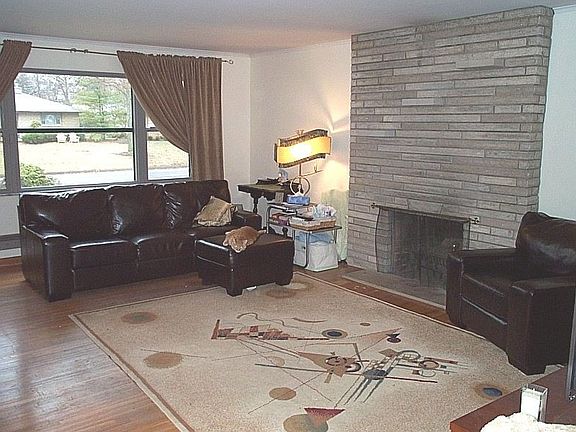Spacious living room offers: Eastern exposure, stone fireplace, hardwood floor