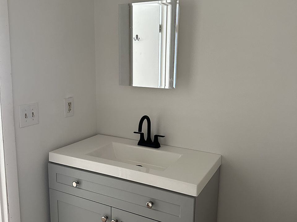 A well?maintained bathroom with a convenient sink and easy?to?clean surfaces.