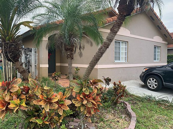 Come and take a look at the front entrance located on the side of the home! Note the exquisite landscaping!