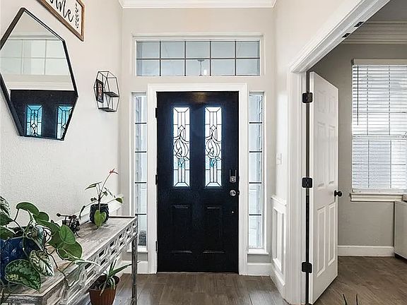 Entryway door/area with office or formal dining on the right.