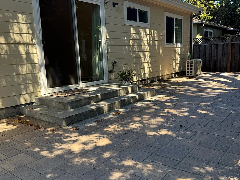 Private spacious patio with outdoor lighting