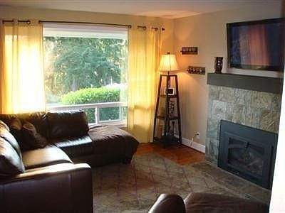 The living room enjoys a peak sound view from the huge picture window.