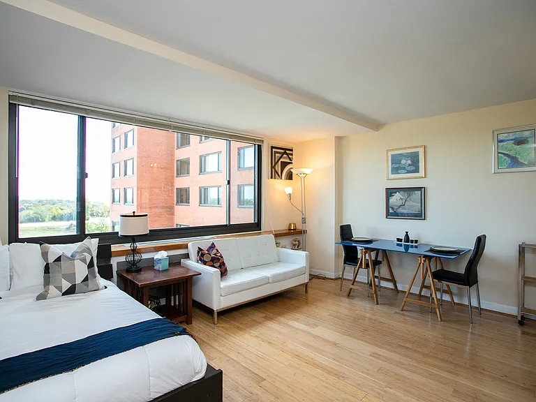 Gleaming bamboo hardwood floors. Built-in bookcases beneath double-pane windows.