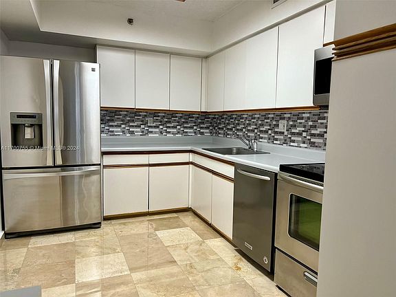 5th image of 3600 Mystic Pointe Dr APT 214