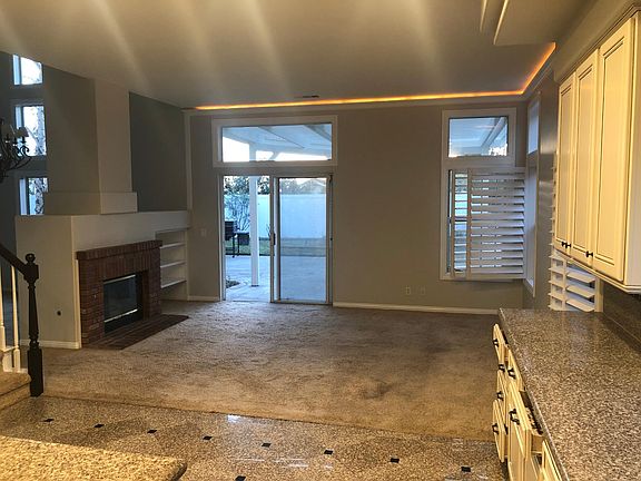 Fireplace and carpets will be redone prior to move-in. Fireplace will be a modern stacked stone in gray colors. Carpet grey to complement walls.