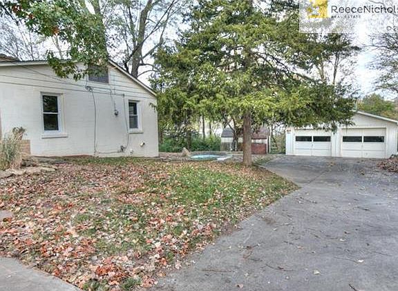 The side of the home, a water feature pond, a firepit, and a detached 24' X 30' ft air/heated garage.