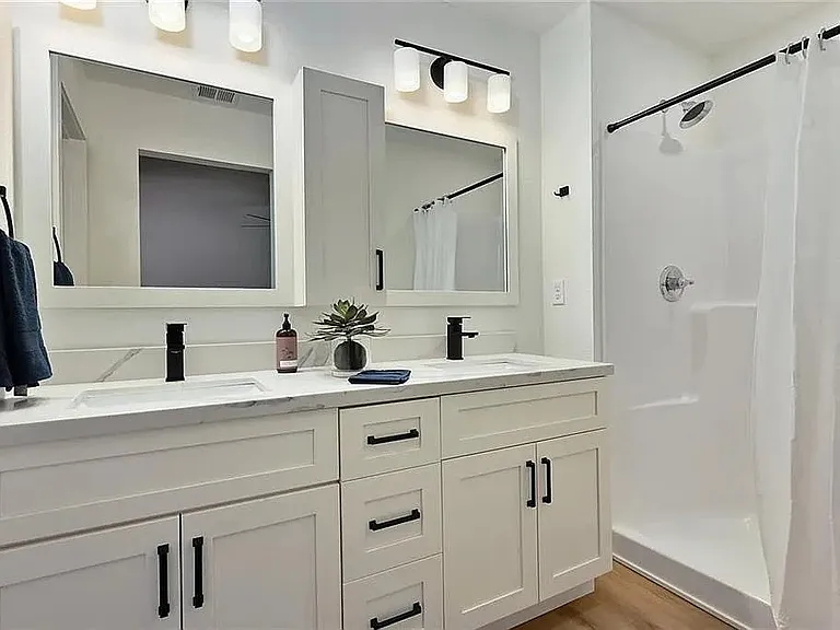 Spa-inspired primary bathroom featuring dual vanities, modern finishes, and a bright contemporary design.

Photos are representative and finishes or layouts may vary slightly by unit.