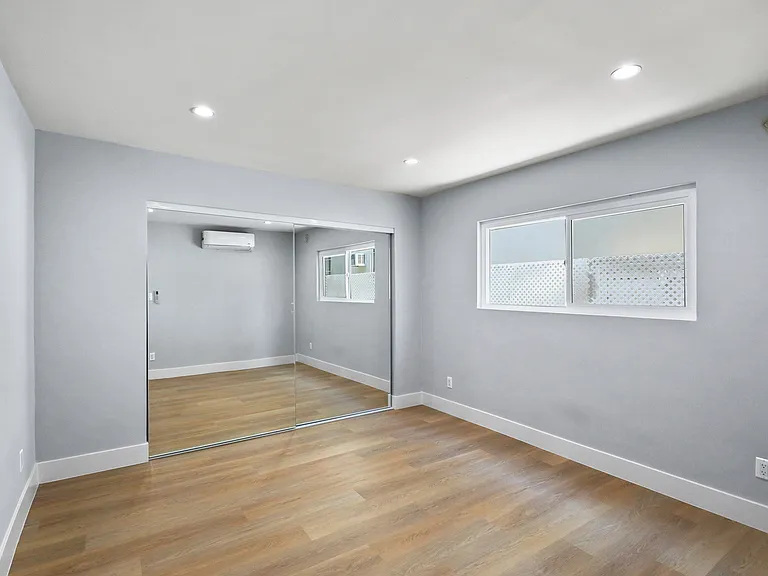 Bedroom with Large Mirrored Closet