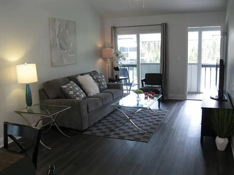 LIVING ROOM TO LANAI, CORTEC VINYL FLOORING THRU-OUT