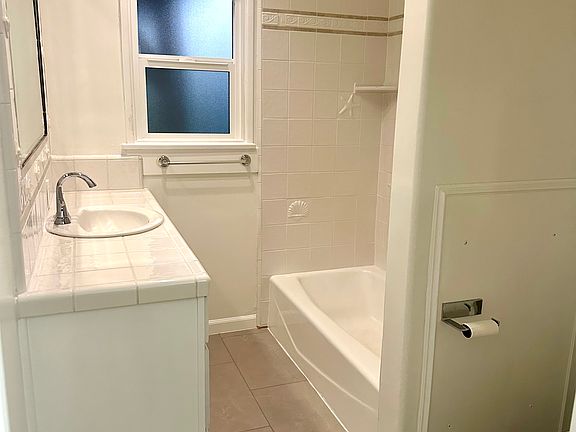 Tiled bathroom, with Toto toilet