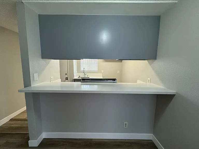 Bar seating conveniently connected to the kitchen.