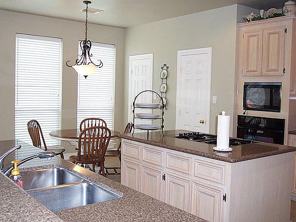 Another view of the kitchen and breakfast area.