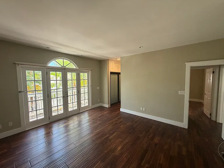 Main Bedroom - en suite through the left - double closets on both sides.