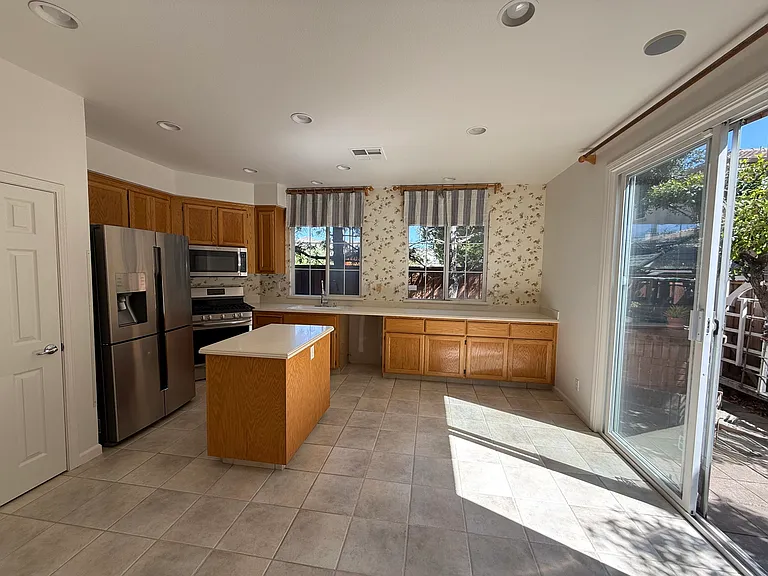 Open floor plan dining room and kitchen area with recess lights