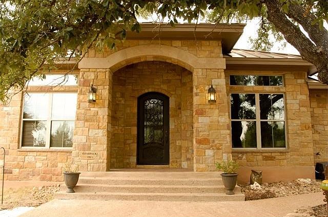 Grand front entrance with steel door.