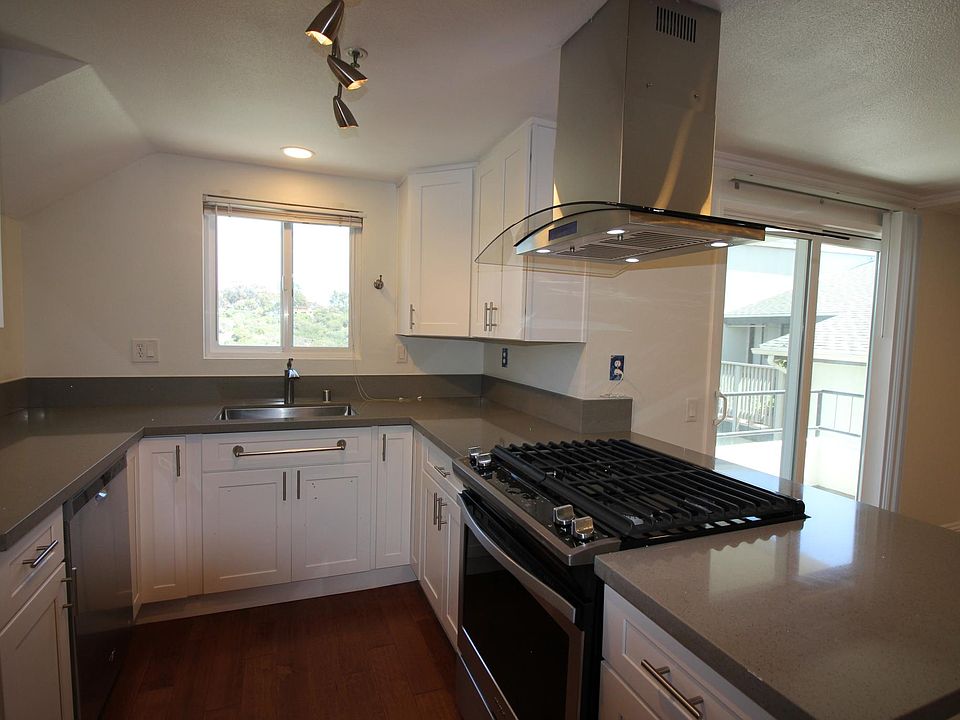 Updated kitchen, range island vent hood, fridge, dishwasher, garbage disposal
